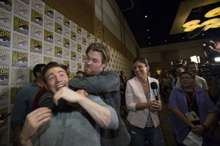 Cast member Chris Hemsworth (2nd L) jokes with co-star Chris Evans (L) at a press line for the movie &quot;Avengers: Age of Ultron&quot;