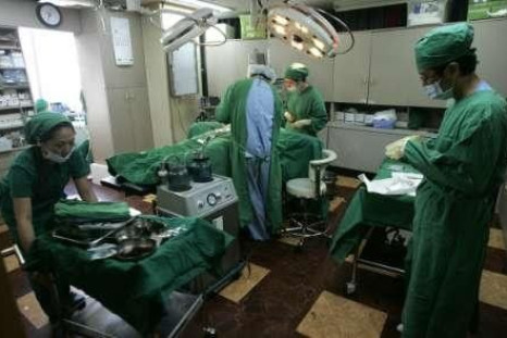 Plastic surgeons prepare to perform surgery at an operating room in BK Clinic