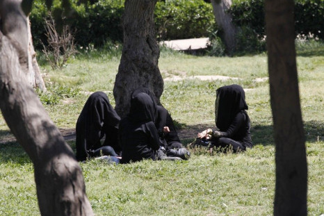 Veiled women sit as they chat in a garden in the northern province of Raqqa March 31, 2014.