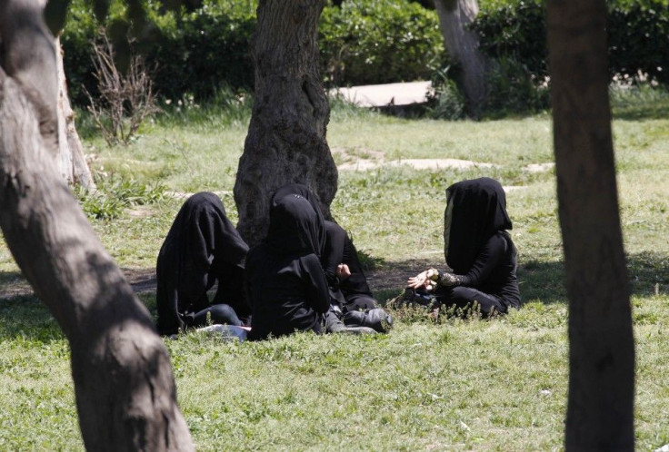 Veiled women sit as they chat in a garden in the northern province of Raqqa March 31, 2014.