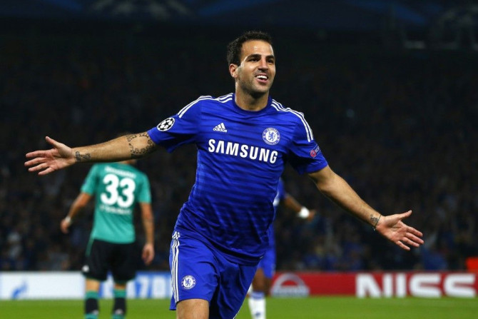 Chelsea's Cesc Fabregas celebrates after scoring a goal against Schalke 04 during their Champions League soccer match against at Stamford Bridge in London September 17, 2014. 