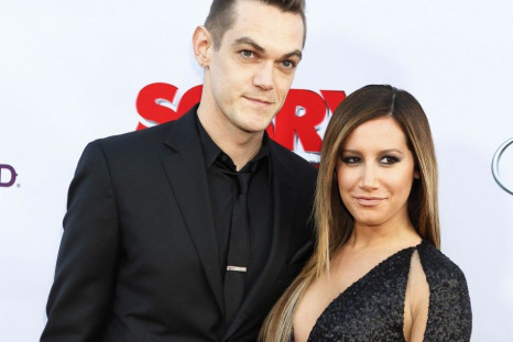 Cast member Ashley Tisdale and her boyfriend Christopher French arrive at the premiere of her new film &quot;Scary Movie 5&quot; in Hollywood April 11, 2013.