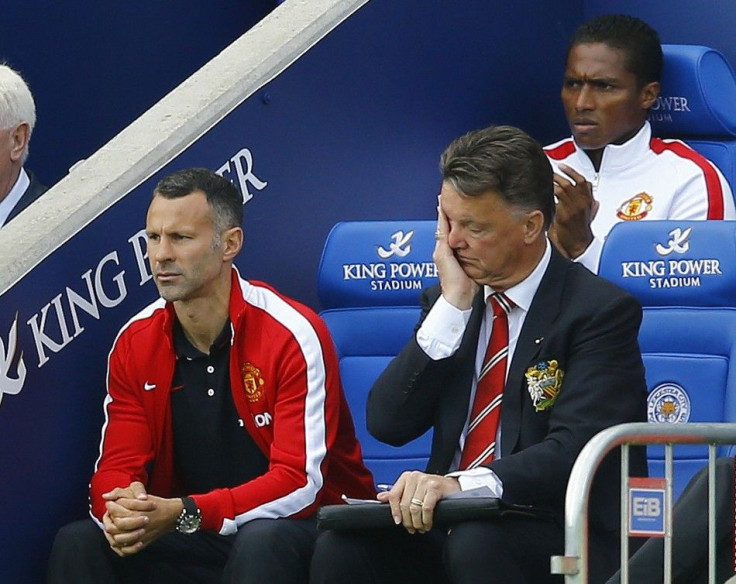 Manchester United manager Louis Van Gaal (R) and his assistant Ryan Giggs react during their English Premier League soccer match against Leicester City at the King Power stadium in Leicester, northern England September 21, 2014.