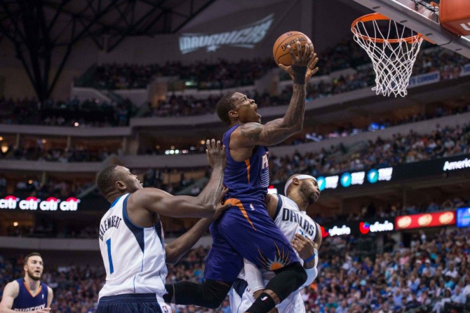 Apr 12, 2014; Dallas, TX, USA; Phoenix Suns guard Eric Bledsoe (2) drives to the basket past Dallas Mavericks center Samuel Dalembert (1) and guard Vince Carter (25) during the first half at the American Airlines Center.