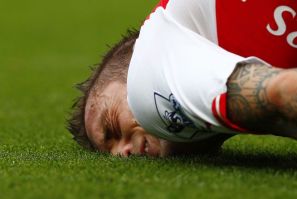 Arsenal&#039;s Mathieu Debuchy reacts after being fouled during their English Premier League soccer match against Manchester City at the Emirates stadium in London September 13, 2014.
