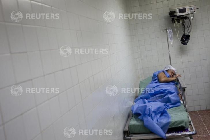 Yojaimi Garcia, 20, pregnant of triplets waits her turn to undergo a caesarean section at the Santa Ana public maternity hospital in Caracas October 23, 2011. The world&#039;s population will reach seven billion on October 31, according to projections by 
