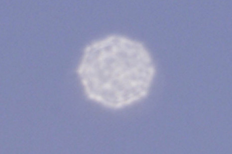 An Unidentified Object Flies Over Mexico City, Seen Through A Very Long Telephoto Lens