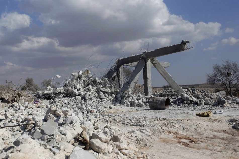 A damaged site is seen in what activists say was a U.S. strike, in Kfredrian, Idlib province September 23, 2014.  REUTERSAbdalghne Karoof