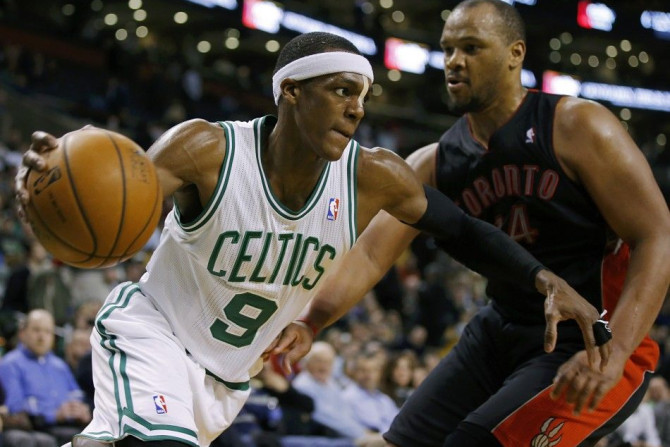 Mar 26, 2014; Boston, MA, USA; Boston Celtics guard Rajon Rondo (9) drives the ball against Toronto Raptors forward Chuck Hayes (44) in the second half at TD Garden. Toronto defeated Boston 99-90.