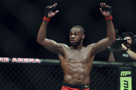 Apr 26, 2014; Baltimore, MD, USA; Jon Jones puts his arms in the air after the UFC light heavy weight championship fight against Glover Texeira at Baltimore Arena. Jones retained the light heavy weight championship by defeating Teixeria.