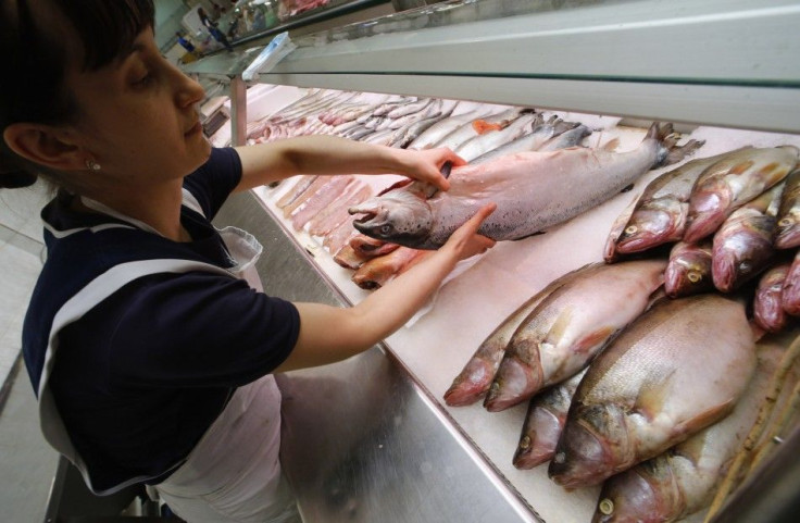 A vendor sells Norwegian fish at the city market in St. Petersburg August 7, 2014.