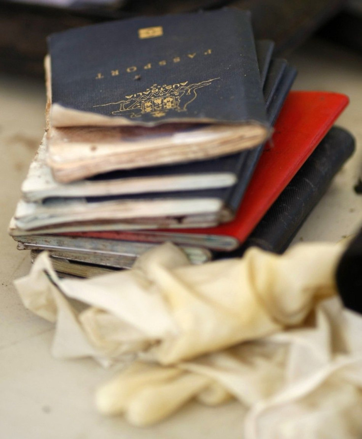 An Australian Passport Lies Atop A Pile Of Foreign And Local Passports Of Tsunami Victims