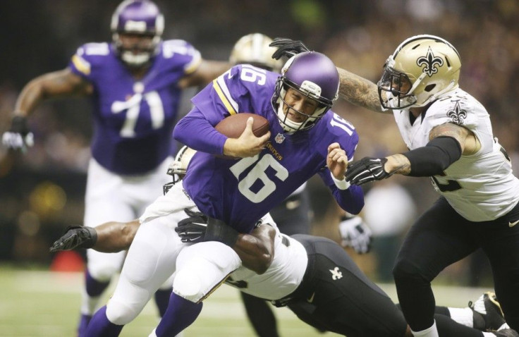 Sep 21, 2014; New Orleans, LA, USA; New Orleans Saints strong safety Kenny Vaccaro (right) and middle linebacker Curtis Lofton (behind) tackle Minnesota Vikings quarterback Matt Cassel (16) in the first half at Mercedes-Benz Superdome.