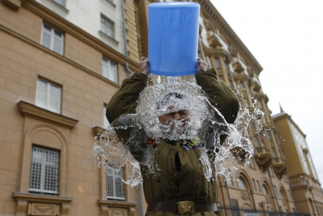 Alexei Didenko, a deputy for the Russian State Duma, dumps a bucket of cold water on himself