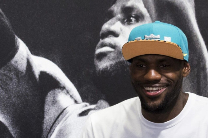 NBA basketball player LeBron James of the U.S. team Cleveland Cavaliers smiles during a promotional event in Hong Kong July 23, 2014.