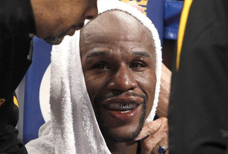 WBC/WBA welterweight champion Floyd Mayweather Jr. sits in his corner between rounds during his title fight against Marcos Maidana of Argentina at the MGM Grand Garden Arena in Las Vegas, Nevada