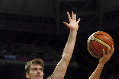 Stephen Curry of the U.S. goes up for a basket over Slovenia's Zoran Dragic