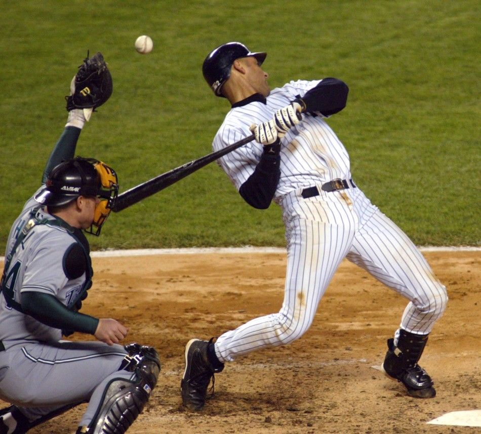 New York Yankees batter Derek Jeter bails out on a high hard pitch