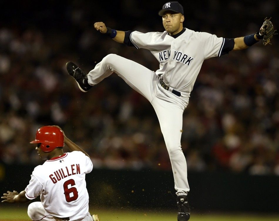 New York Yankees Derek Jeter turns a double play