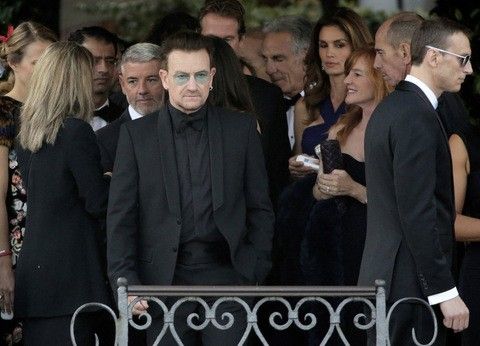 Irish singer Bono front C, lead vocalist of band U2, arrives to board a taxi boat transporting guests to the venue of a gala dinner ahead of the official wedding ceremony of U.S. actor George Clooney and his fiancee Amal Alamuddin in Venice September 27