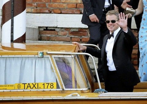 U.S. actor Matt Damon waves as he boards a taxi boat transporting guests to the venue of a gala dinner ahead of the official wedding ceremony of U.S. actor George Clooney and his fiancee Amal Alamuddin in Venice September 27, 2014. The worlds most famous