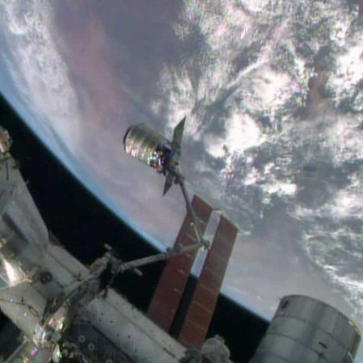 Canadarm2, The International Space Station's Robotic Arm, Grapples The Orbital Sciences' Cygnus Cargo Craft