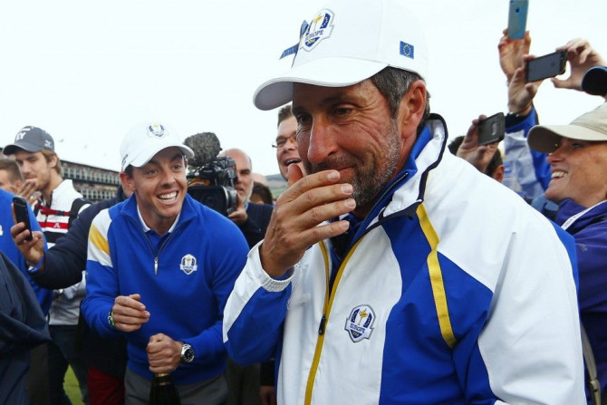 Team Europe golfer Rory McIlroy (L) and vice-captain Jose Maria Olazabal celebrate after retaining the Ryder Cup for Europe, during the 40th Ryder Cup at Gleneagles in Scotland September 28, 2014. Captain Paul McGinley described each of his players as &qu
