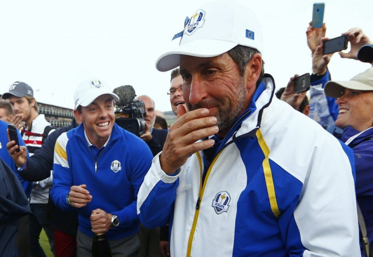 Team Europe golfer Rory McIlroy (L) and vice-captain Jose Maria Olazabal celebrate after retaining the Ryder Cup for Europe, during the 40th Ryder Cup at Gleneagles in Scotland September 28, 2014. Captain Paul McGinley described each of his players as &qu