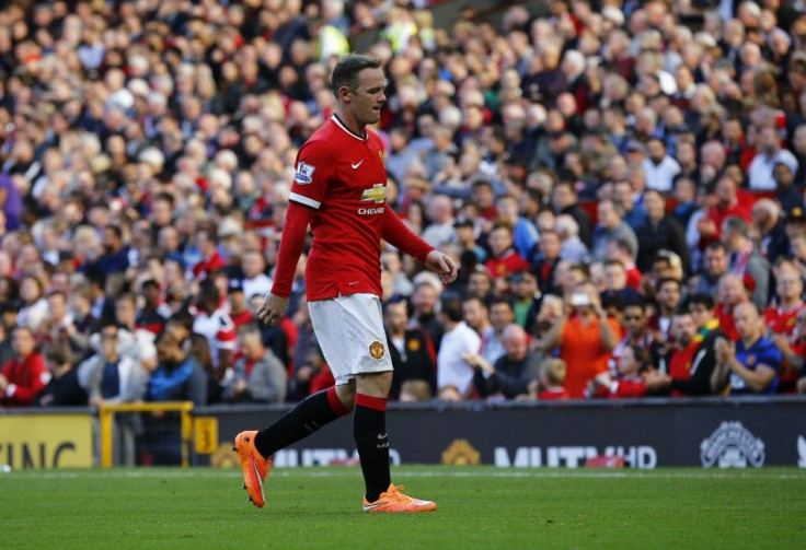 Manchester United's Wayne Rooney reacts as he walks off the pitch after being sent off by match referee Lee Mason (not pictured) during their English Premier League soccer match against West Ham United at Old Trafford in Manchester, northern EngalndS