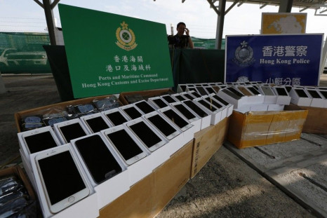 Apple's iPhone 6 are displayed during a news conference by Customs and Excise Department and the police in Hong Kong September 21, 2014. Hong Kong customs and marine police on Saturday foiled a smuggling case involving a speedboat carrying 138 iPhone 6, a