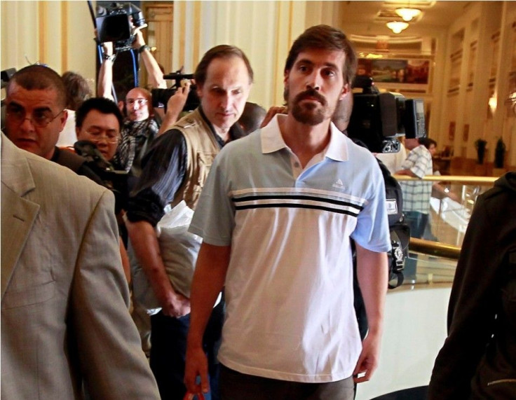 U.S. journalist James Foley (R) arrives with fellow reporter Clare Gillis