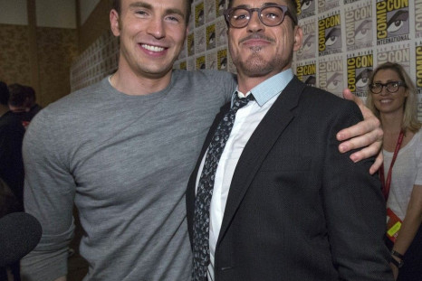 Cast Members Robert Downey Jr. (R) And Chris Evans Pose At A Press Line
