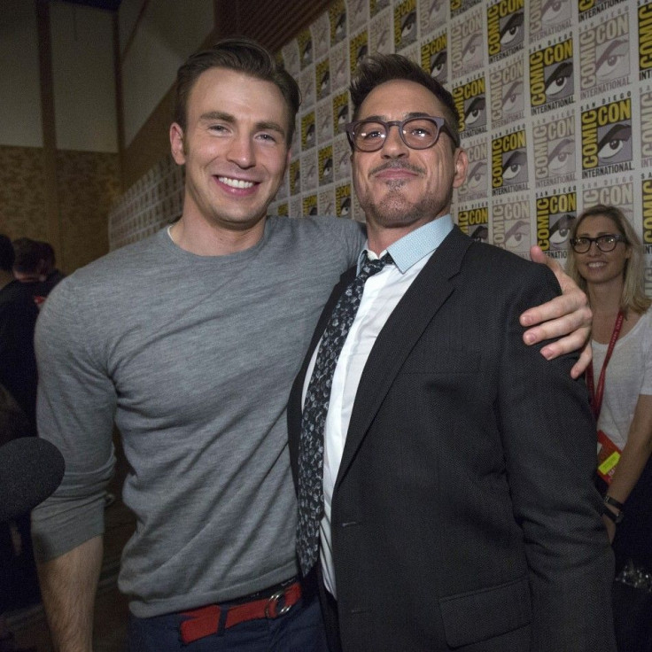 Cast Members Robert Downey Jr. (R) And Chris Evans Pose At A Press Line