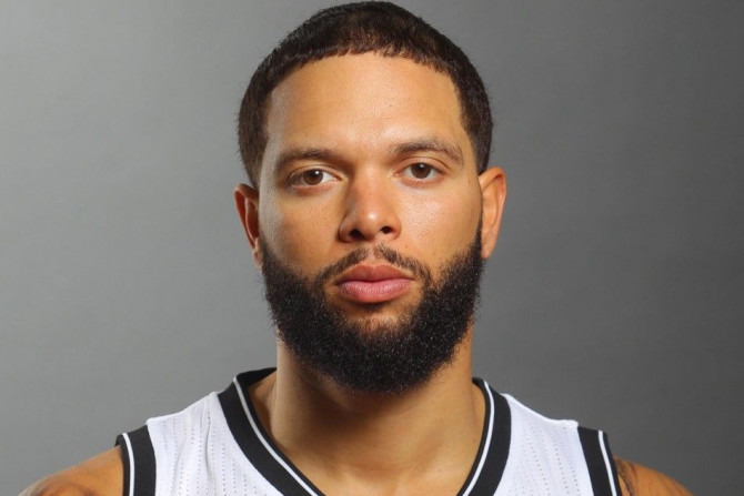 Sep 26, 2014; East Rutherford, NJ, USA; Brooklyn Nets point guard Deron Williams (8) poses for a photo during media day at the Brooklyn Nets Practice Facility.