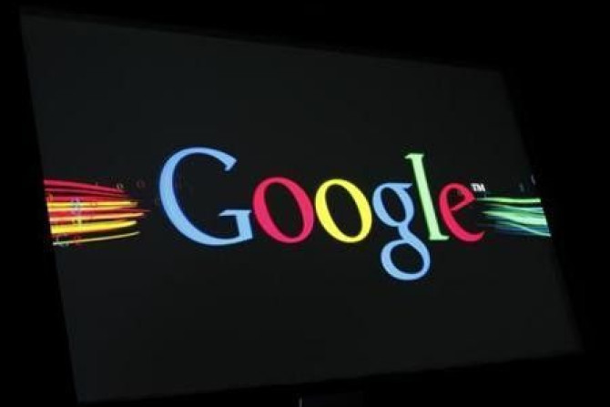 The Google Inc logo is projected on a screen