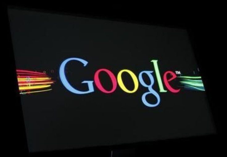 The Google Inc logo is projected on a screen