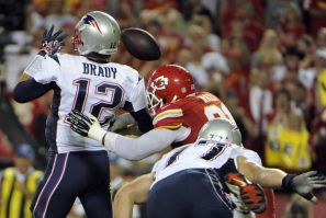 Kansas City Chiefs outside linebacker Tamba Hali causes a fumble from New England Patriots quarterback Tom Brady