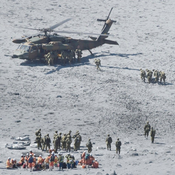 Japan Self-Defense Force (JSDF) soldiers and firefighters conduct rescue operations near the peak of Mt. Ontake, which straddles Nagano and Gifu prefectures, central Japan October 1, 2014, in this photo taken and released by Kyodo. The death toll from Jap