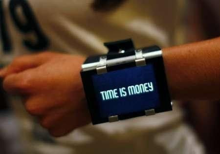 A model poses for a picture wearing a wrist watch