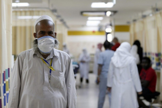 A Muslim pilgrim wears a protective mask in the emergency department at Al-Noor Specialist Hospital in Mecca September 30, 2014. According to hospital director Dr. Mohammad bin Omar, the hospital did not record any cases of pilgrims bearing the MERS coron