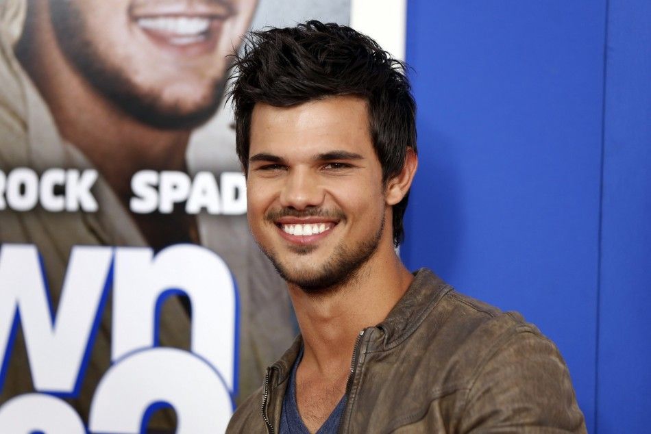 Actor Taylor Lautner arrives for the premiere of the film Grown Ups 2