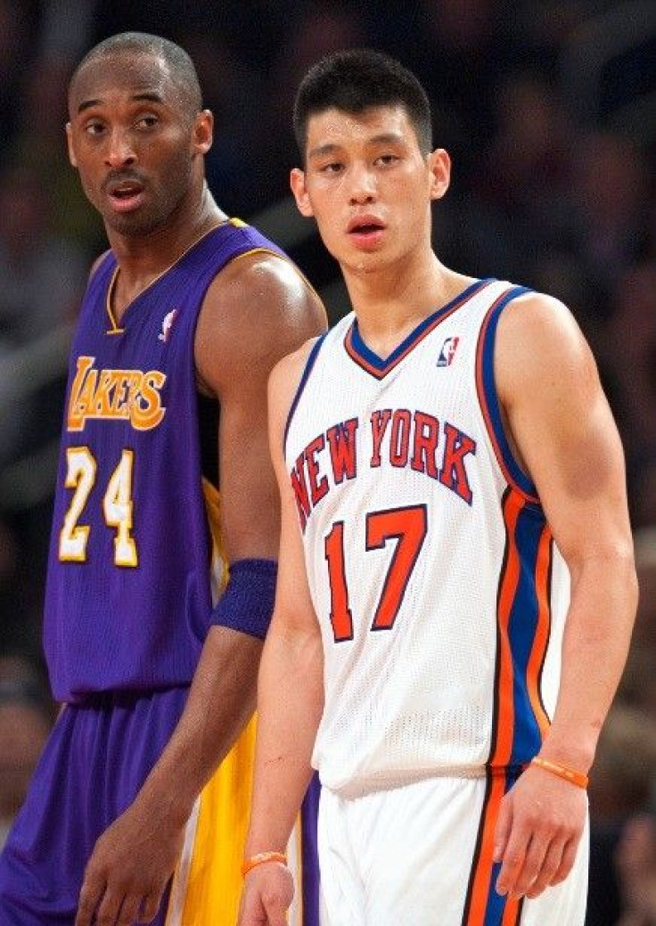 New York Knicks' guard Jeremy Lin (17) and Los Angeles Lakers' guard Kobe Bryant (24) pause as a foul is shot in the third quarter of their NBA basketball game at Madison Square Garden in New York February 10, 2012.
