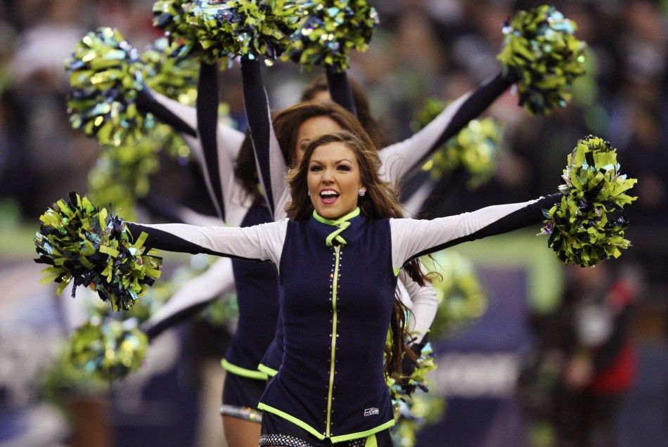 A Seattle Seahawks cheerleader performs 