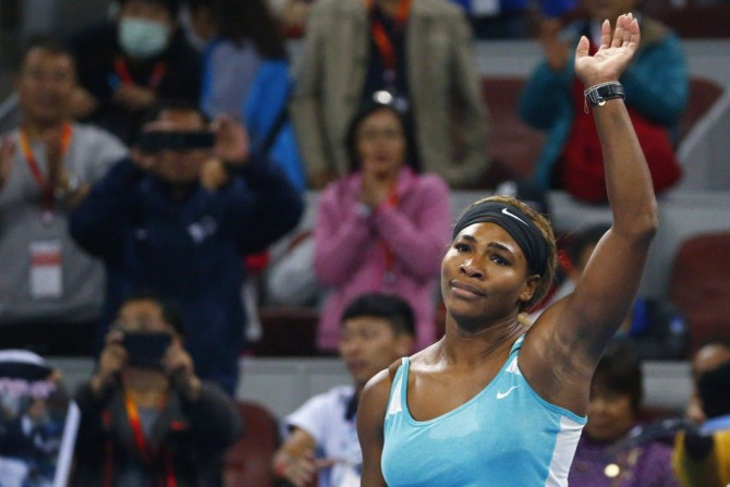 Serena Williams of the U.S. acknowledges the crowd after winning the women's singles match against Lucie Safarova of the Czech Republic at the China Open tennis tournament in Beijing October 2, 2014. REUTERS/Petar Kujundzic