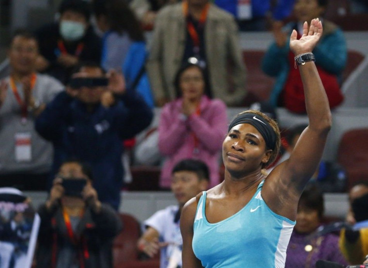 Serena Williams of the U.S. acknowledges the crowd after winning the women's singles match against Lucie Safarova of the Czech Republic at the China Open tennis tournament in Beijing October 2, 2014. REUTERS/Petar Kujundzic