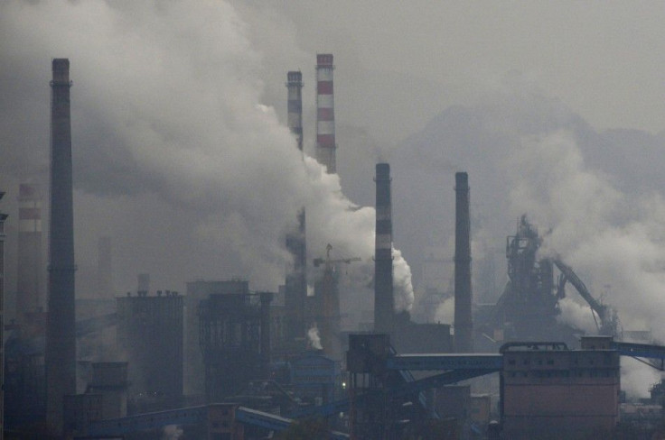 Smoke rises from chimneys and facilities of steel plants on a hazy day in Benxi, Liaoning province November 3, 2013. A chronic shortage of natural gas is hurting China's plan to move away from burning coal to heat homes and offices, raising the prosp