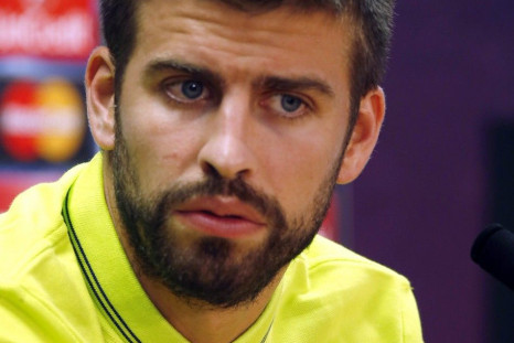 Barcelona's Gerard Pique speaks during a news conference after their training session on the eve of their Champions League match against Apoel at Ciutat Esportiva Joan Gamper training grounds in Sant Joa Despi near Barcelona September 16, 2014.
