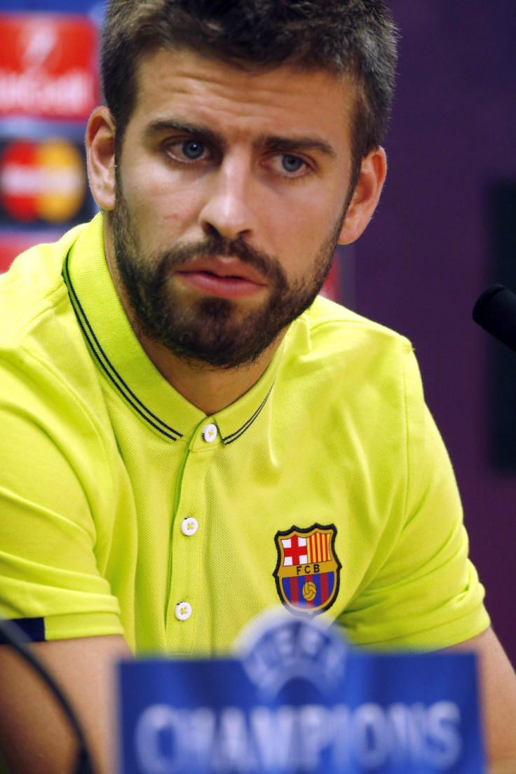 Barcelona's Gerard Pique speaks during a news conference after their training session on the eve of their Champions League match against Apoel at Ciutat Esportiva Joan Gamper training grounds in Sant Joa Despi near Barcelona September 16, 2014.