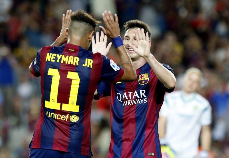 Barcelona's Neymar (L) celebrates his second goal with Lionel Messi against Mexico's club Leon during their Joan Gamper Trophy soccer match at Nou Camp stadium in Barcelona August 18, 2014.