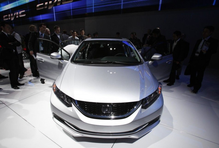 Attendees look at the 2013 Honda Civic EX